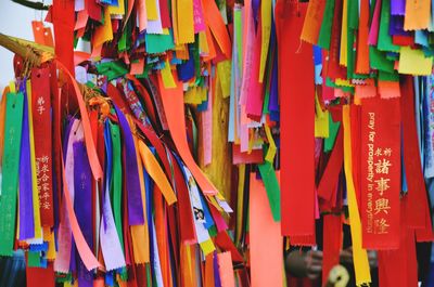 Close-up of multi colored flags hanging