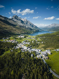 Aerial image of maloja village and mountain pass road, engadin, switzerland