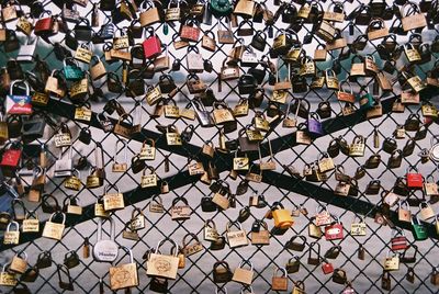 Close-up of padlocks on railing