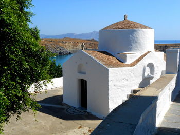 Built structure against blue sky on sunny day