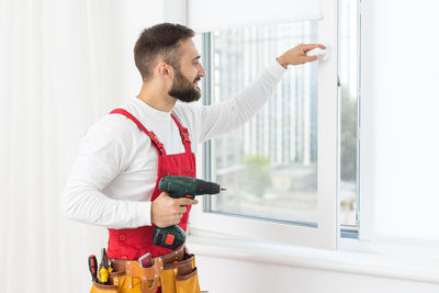 Side view of man working at home