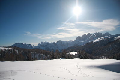 Scenic view of snow covered mountains against sky