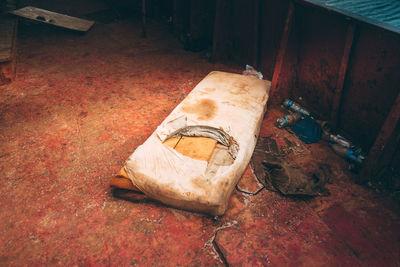 High angle view of broken wood on floor