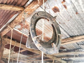 Low angle view of old rusty wheel