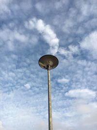 Low angle view of gas light against sky