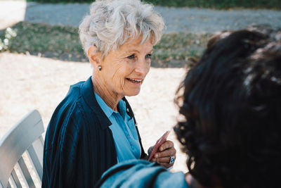 Portrait of a smiling young woman outdoors