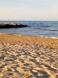 Scenic view of beach against clear sky