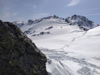 Scenic view of snowcapped mountains against sky