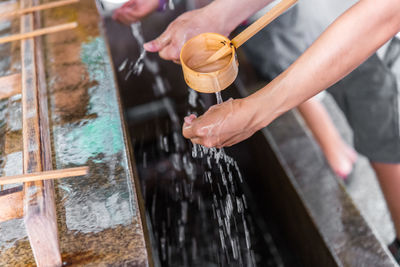 High angle view of man holding water fountain