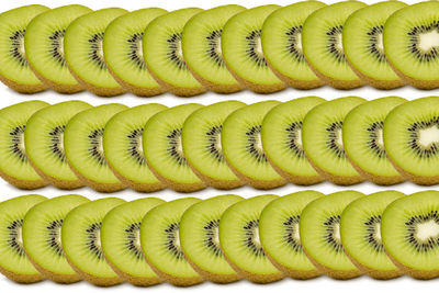 Close-up of kiwi slices on white background