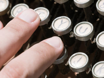 Close-up of hand holding machine