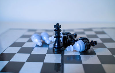 Close-up of chess pieces on board