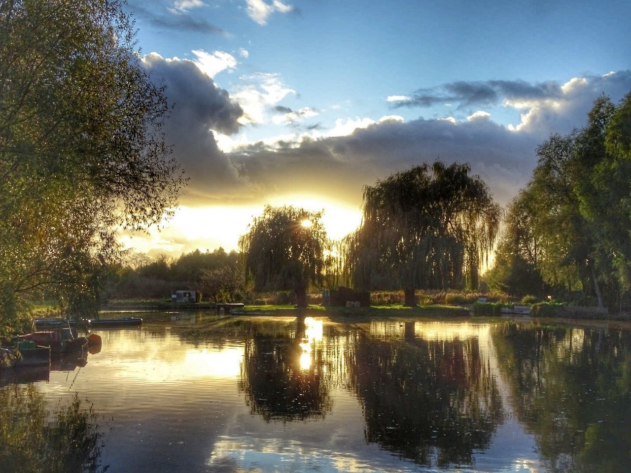 TREES BY LAKE AGAINST SKY DURING SUNSET