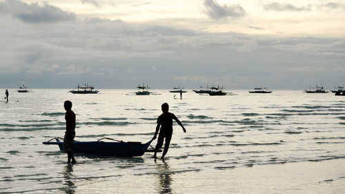 Silhouette of people on beach