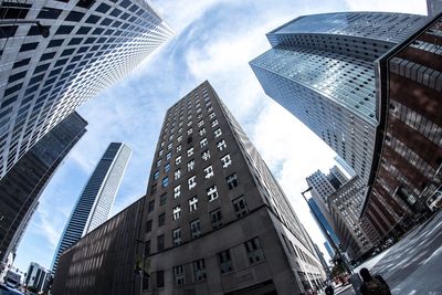 Low angle view of modern buildings against sky