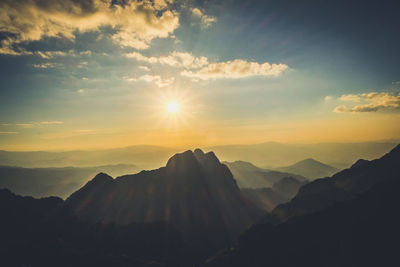 Scenic view of silhouette mountains against sky during sunset