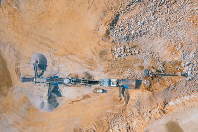 High angle view of people on rock