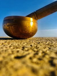 Close-up of sand on beach against clear sky
