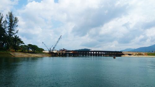 Bridge over sea against sky