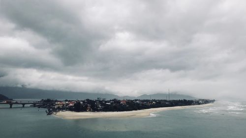 Scenic view of sea against storm clouds