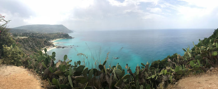 Panoramic view of bay against sky