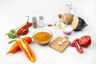 High angle view of food on table against white background