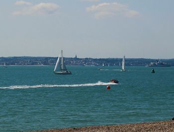 Sailboat sailing in sea