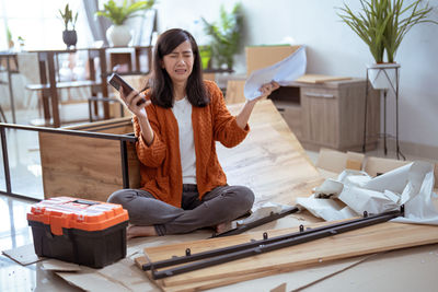 Portrait of young woman working at home