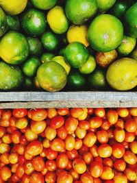 High angle view of oranges in market for sale