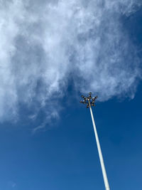 Low angle view of security camera against sky