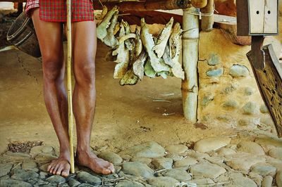 Low section of woman standing on tiled floor