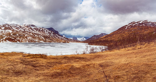 Scenic view of snowcapped mountains against sky