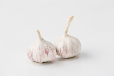 Close-up of garlic against white background