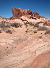 Rock formations in desert against clear sky