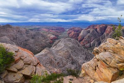 Rock formation on landscape against sky