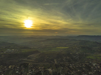 Scenic view of field against sky during sunset