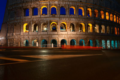 No people on the street near colosseum in rome . famous architecture illuminated in the night 