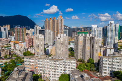 Buildings in city against sky