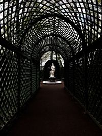 Rear view of woman in tunnel