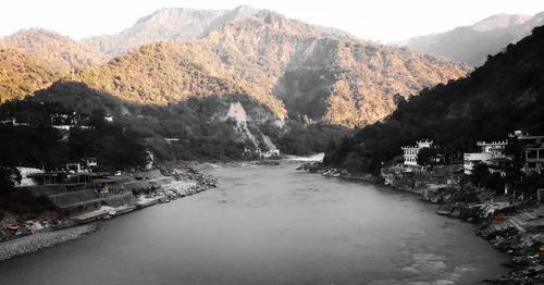 Scenic view of river amidst buildings in town