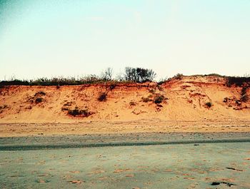 Scenic view of desert against clear sky