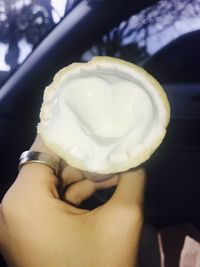 Close-up of hand holding ice cream