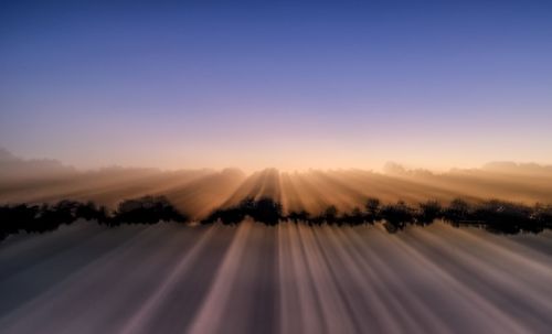 Scenic view of landscape against blue sky
