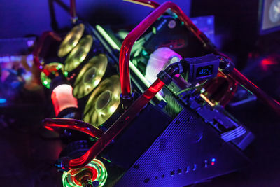 Close-up of illuminated machinery in illuminated room