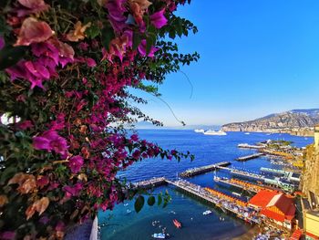 Scenic view of sea by swimming pool against sky