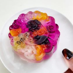 High angle view of multi colored candies in plate