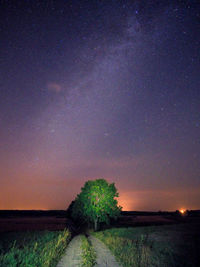 Scenic view of field against sky at night