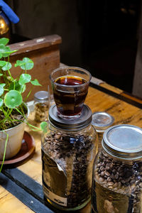 High angle view of glass jar on table