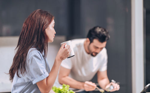 Young couple looking at camera