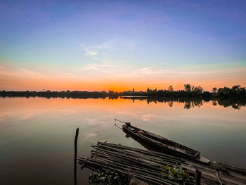 Scenic view of lake against sky during sunset